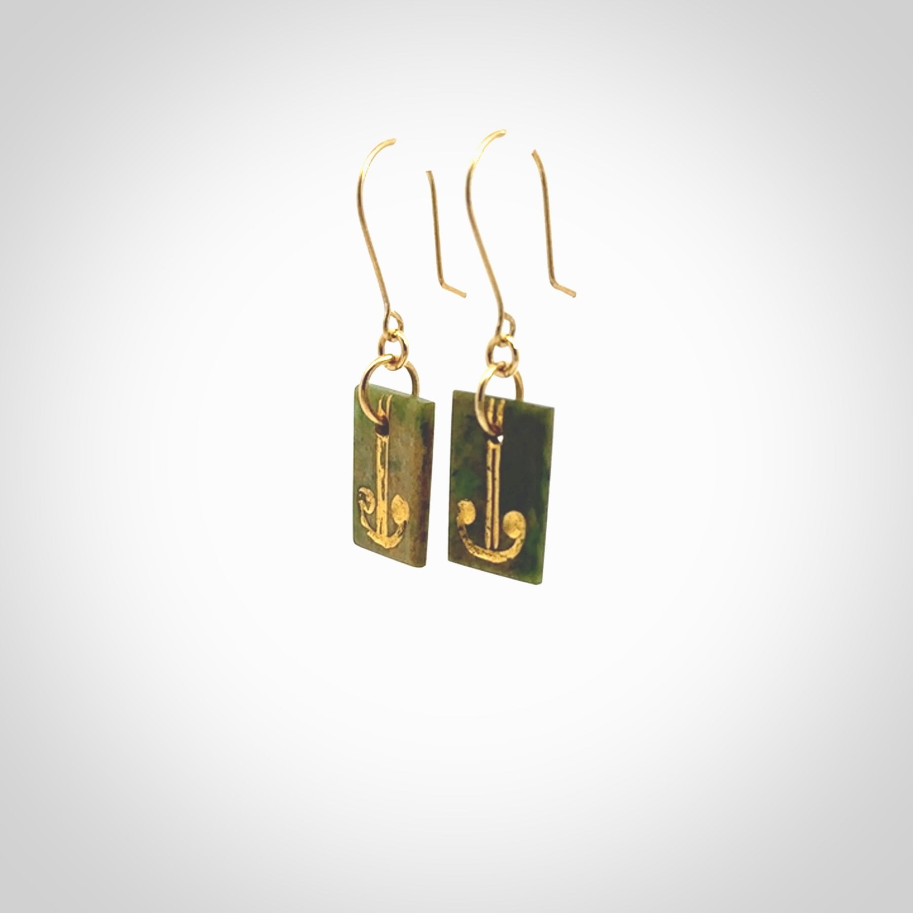 These earrings are beautifully hand made in New Zealand Jade with Gold Enamel. They have koru designs are are gorgeous. They are fashionable and perfect for a women with style. Hand carved from a gorgeous piece of New Zealand Marsden jade with Gold leaf and gold plated hooks - they are elegant and beautiful.