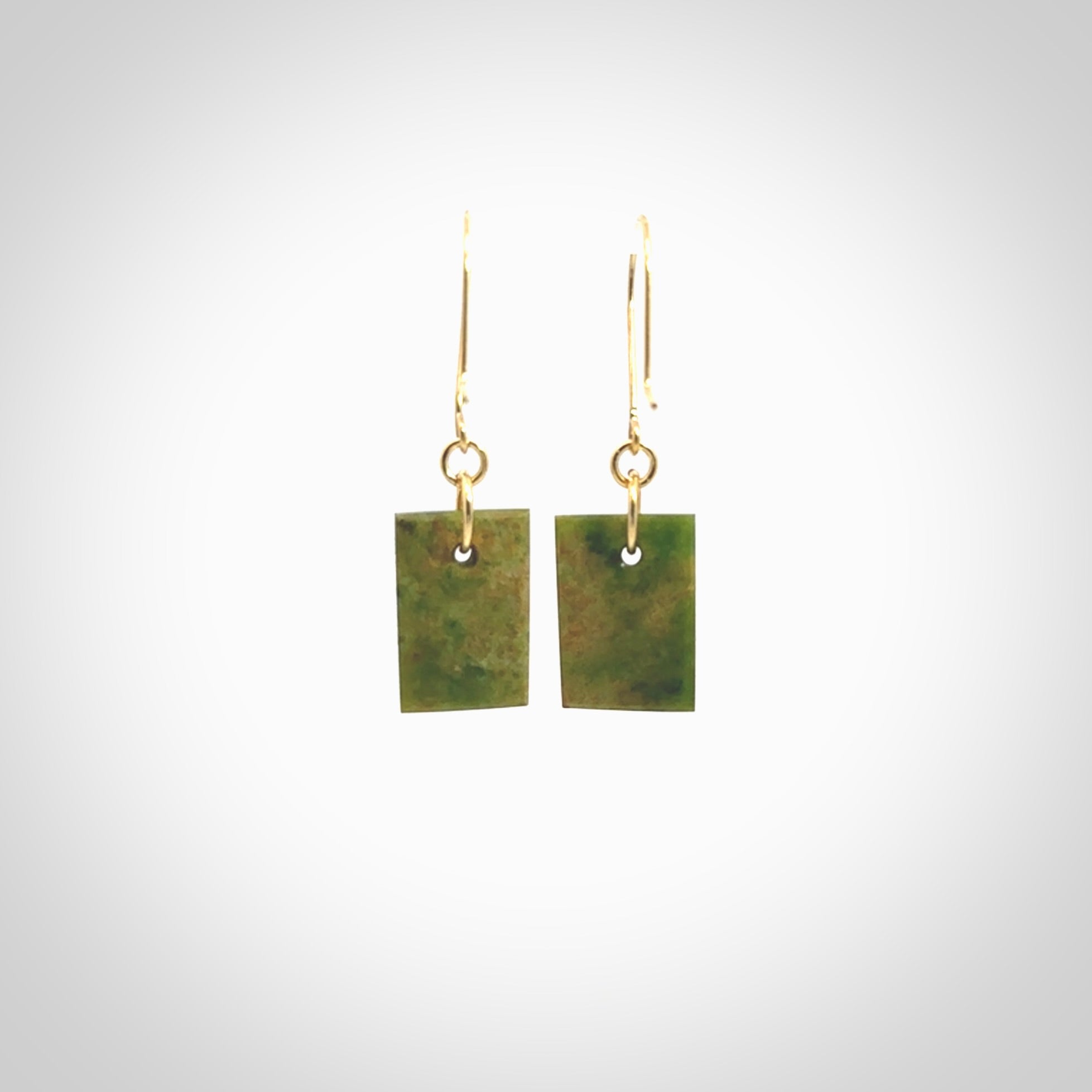 These earrings are beautifully hand made in New Zealand Jade with Gold Enamel. They have koru designs are are gorgeous. They are fashionable and perfect for a women with style. Hand carved from a gorgeous piece of New Zealand Marsden jade with Gold leaf and gold plated hooks - they are elegant and beautiful.