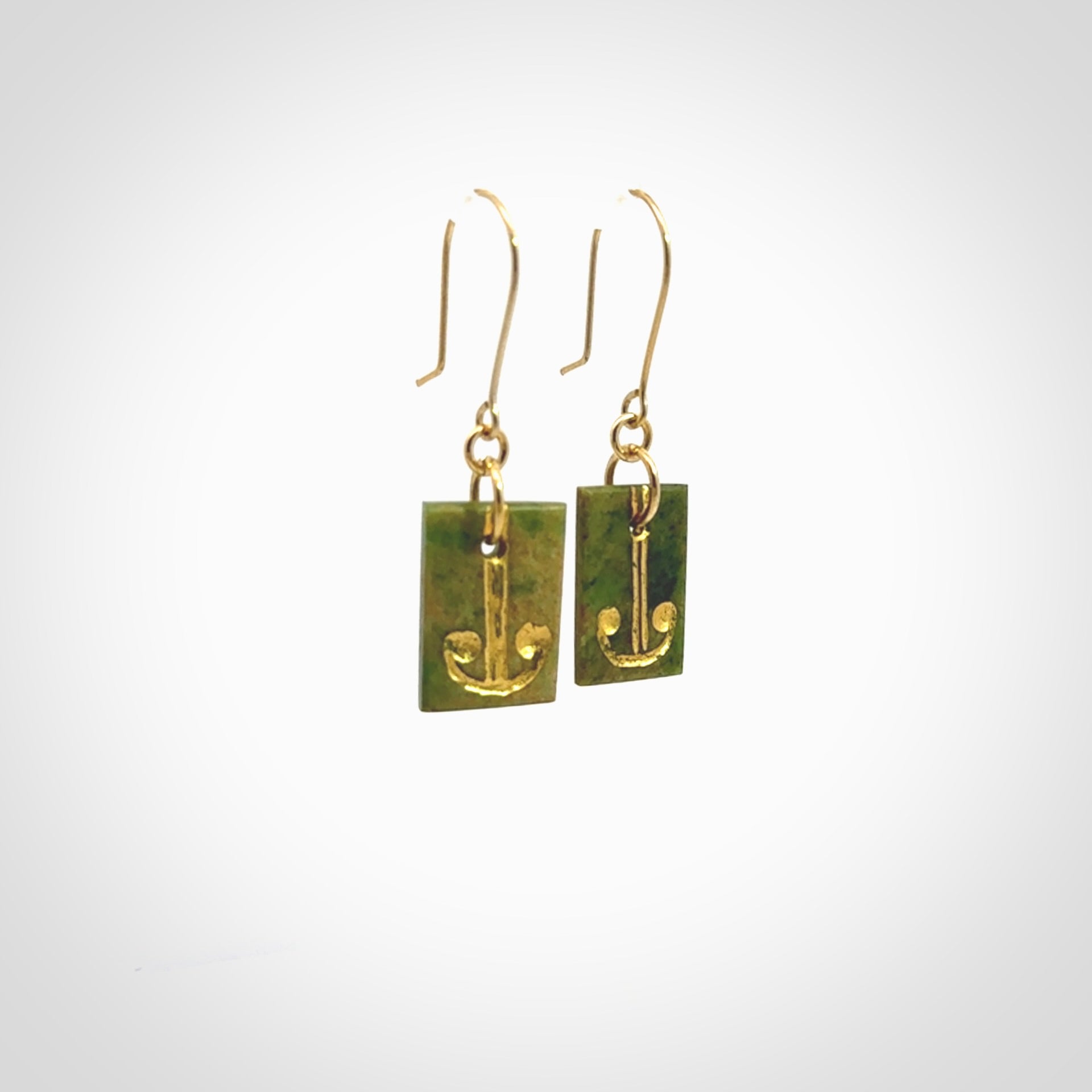 These earrings are beautifully hand made in New Zealand Jade with Gold Enamel. They have koru designs are are gorgeous. They are fashionable and perfect for a women with style. Hand carved from a gorgeous piece of New Zealand Marsden jade with Gold leaf and gold plated hooks - they are elegant and beautiful.