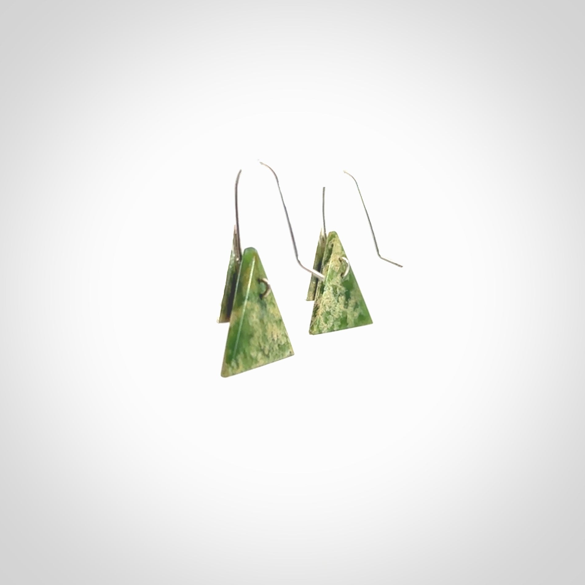 Hand made New Zealand Jade Rata drop earrings with sterling silver and red enamel. Hand crafted by Ana Krakosky. Beautiful Jade earrings hand made in New Zealand. One pair only. Provided in a woven kete pouch.