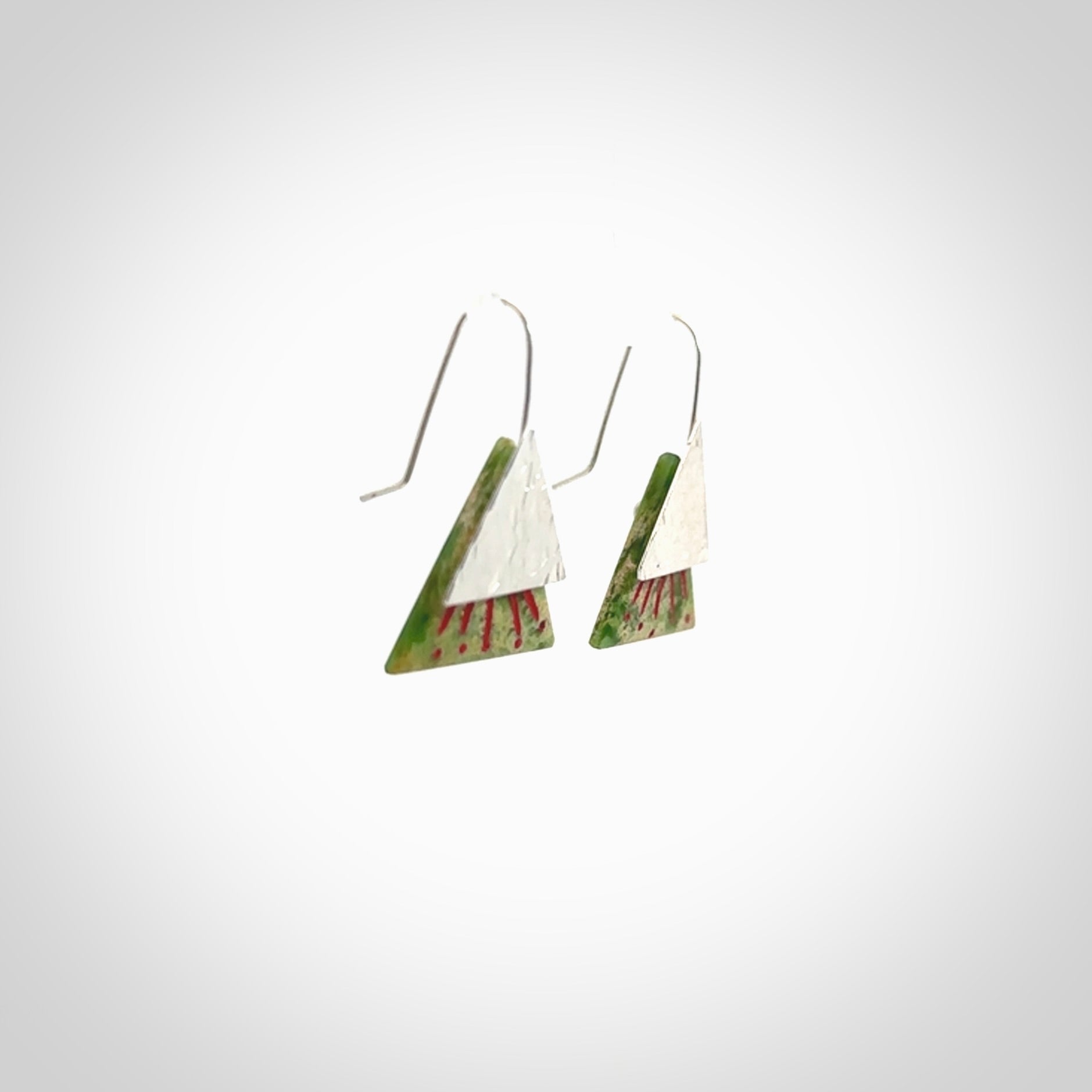 Hand made New Zealand Jade Rata drop earrings with sterling silver and red enamel. Hand crafted by Ana Krakosky. Beautiful Jade earrings hand made in New Zealand. One pair only. Provided in a woven kete pouch.