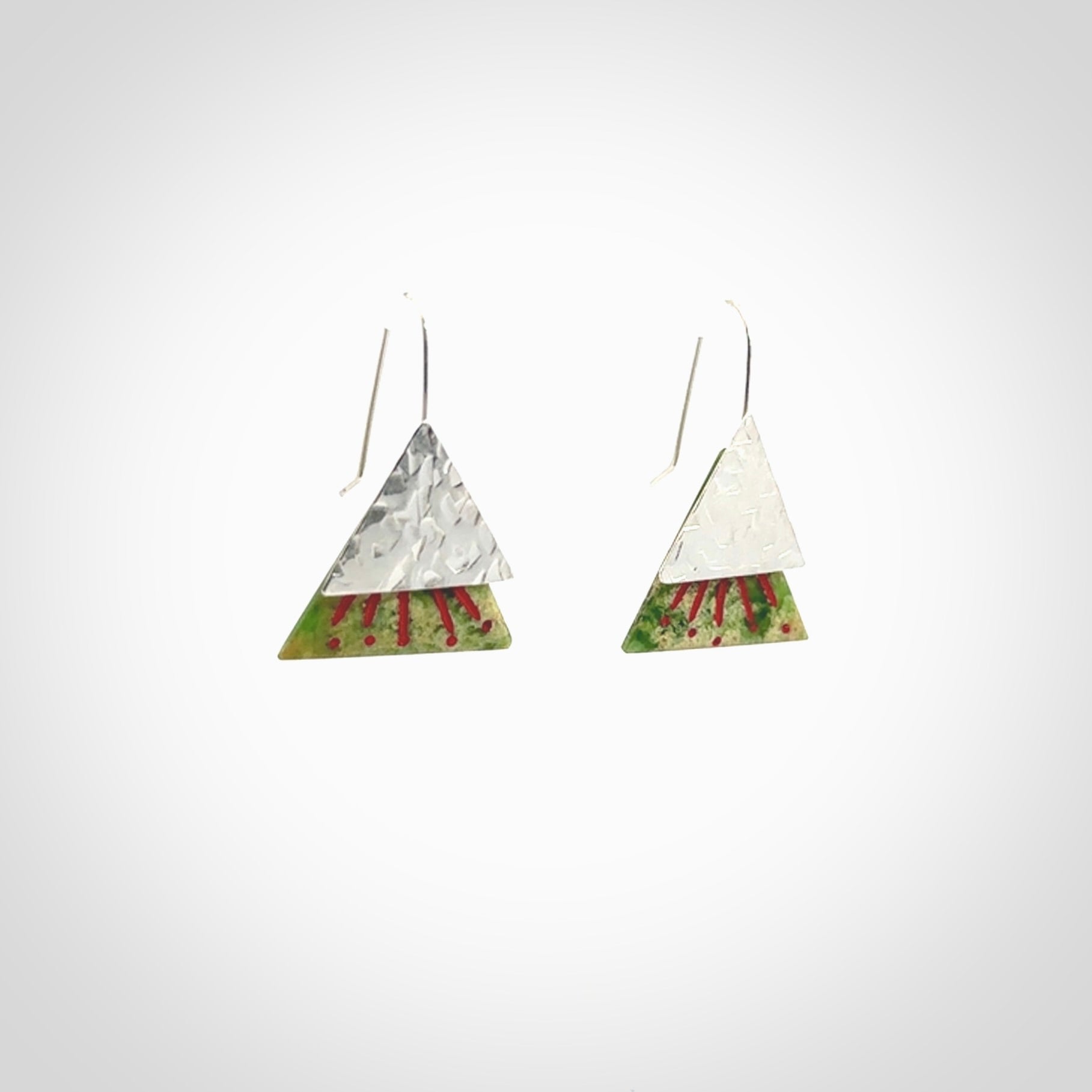 Hand made New Zealand Jade Rata drop earrings with sterling silver and red enamel. Hand crafted by Ana Krakosky. Beautiful Jade earrings hand made in New Zealand. One pair only. Provided in a woven kete pouch.