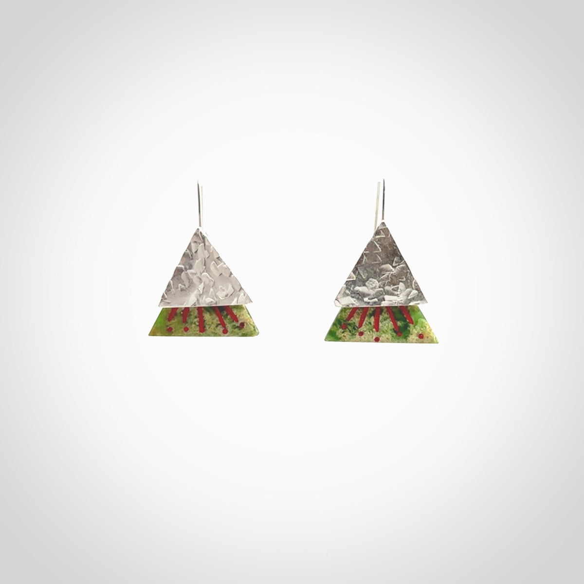 Hand made New Zealand Jade Rata drop earrings with sterling silver and red enamel. Hand crafted by Ana Krakosky. Beautiful Jade earrings hand made in New Zealand. One pair only. Provided in a woven kete pouch.