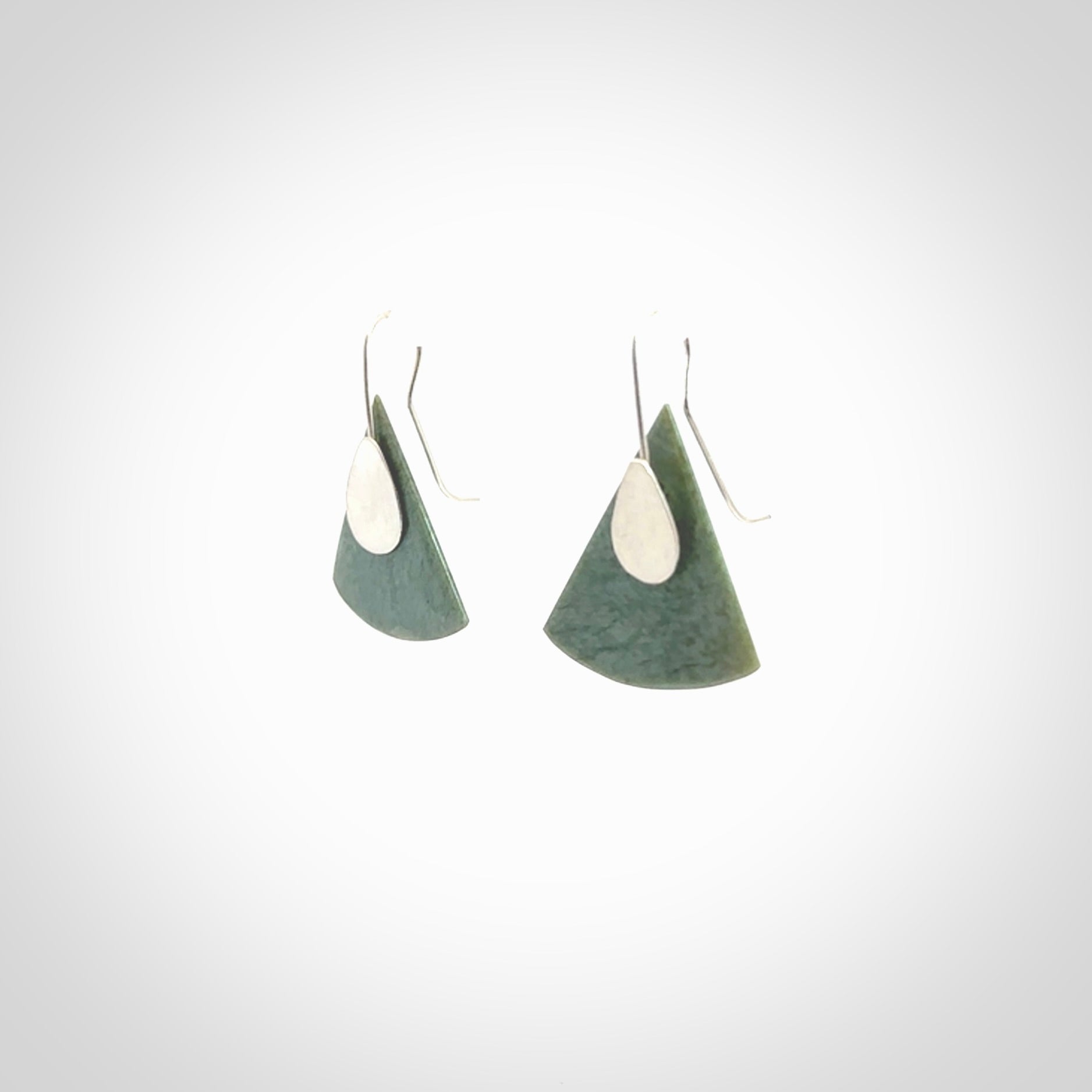 These modern jade drop earrings are beautifully hand made with gorgeous flair and chic design. They are fashionable and perfect for a women with style. Hand carved from a gorgeous piece of New Zealand Inanga jade with sterling silver hooks - they are elegant and beautiful.