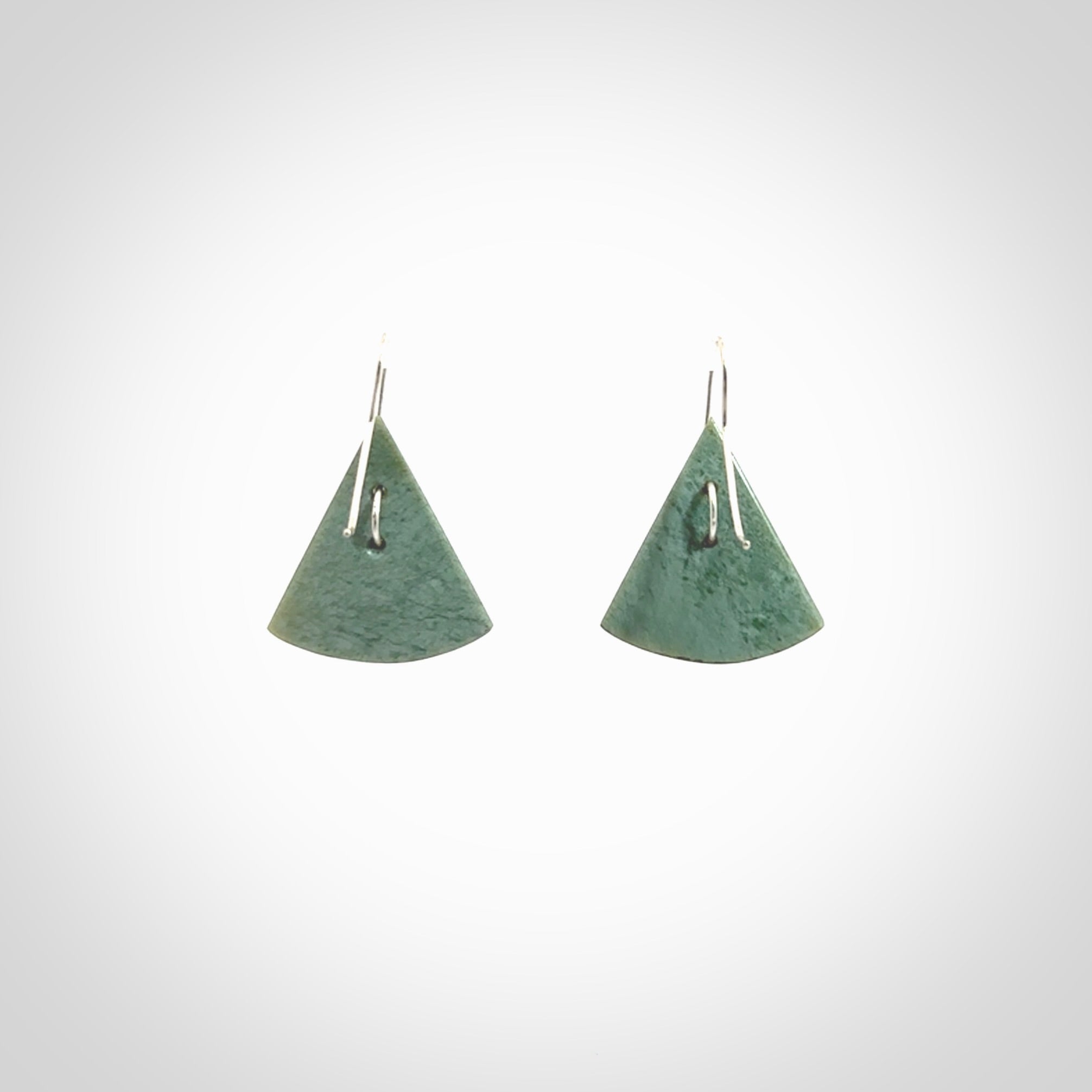 These modern jade drop earrings are beautifully hand made with gorgeous flair and chic design. They are fashionable and perfect for a women with style. Hand carved from a gorgeous piece of New Zealand Inanga jade with sterling silver hooks - they are elegant and beautiful.