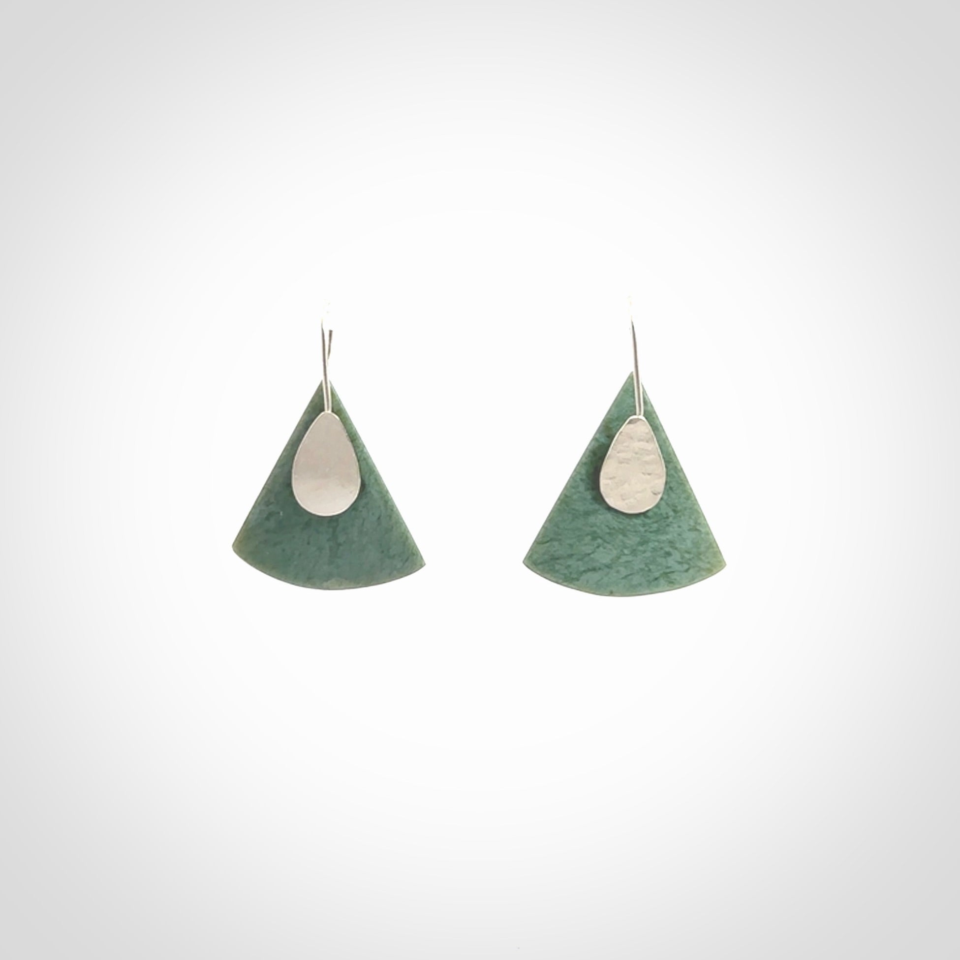 These modern jade drop earrings are beautifully hand made with gorgeous flair and chic design. They are fashionable and perfect for a women with style. Hand carved from a gorgeous piece of New Zealand Inanga jade with sterling silver hooks - they are elegant and beautiful.