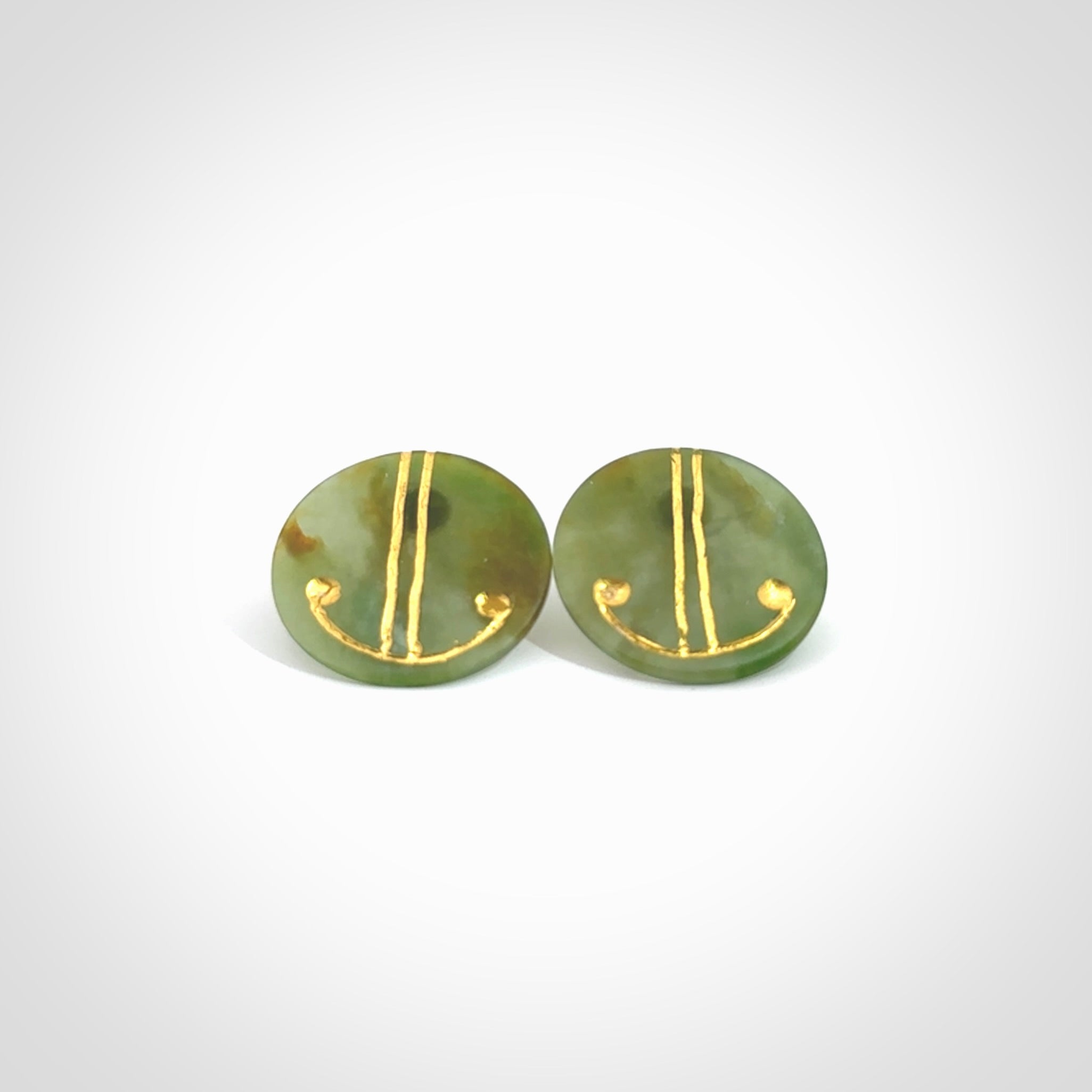 These large round stud earrings are beautifully hand made in New Zealand Jade with Gold Enamel. They have koru designs are are gorgeous. They are fashionable and perfect for a women with style. Hand carved from a gorgeous piece of New Zealand Marsden jade with Gold leaf and gold plated studs - they are elegant and beautiful.