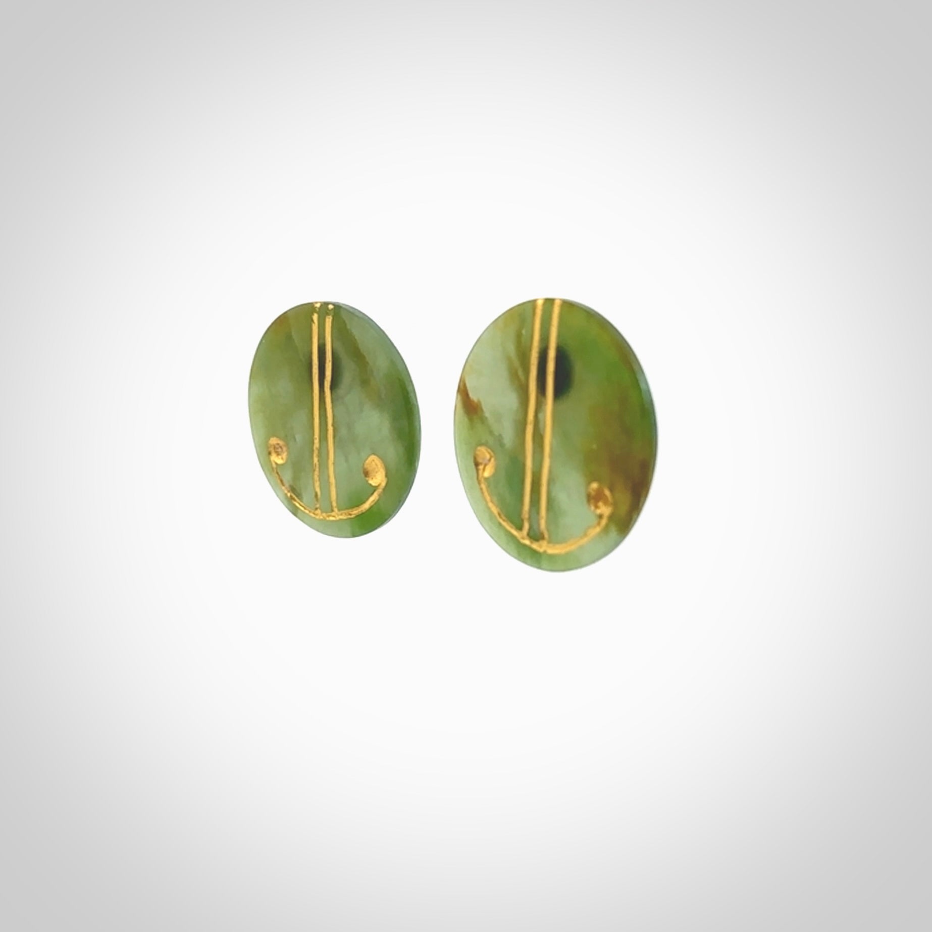 These large round stud earrings are beautifully hand made in New Zealand Jade with Gold Enamel. They have koru designs are are gorgeous. They are fashionable and perfect for a women with style. Hand carved from a gorgeous piece of New Zealand Marsden jade with Gold leaf and gold plated studs - they are elegant and beautiful.