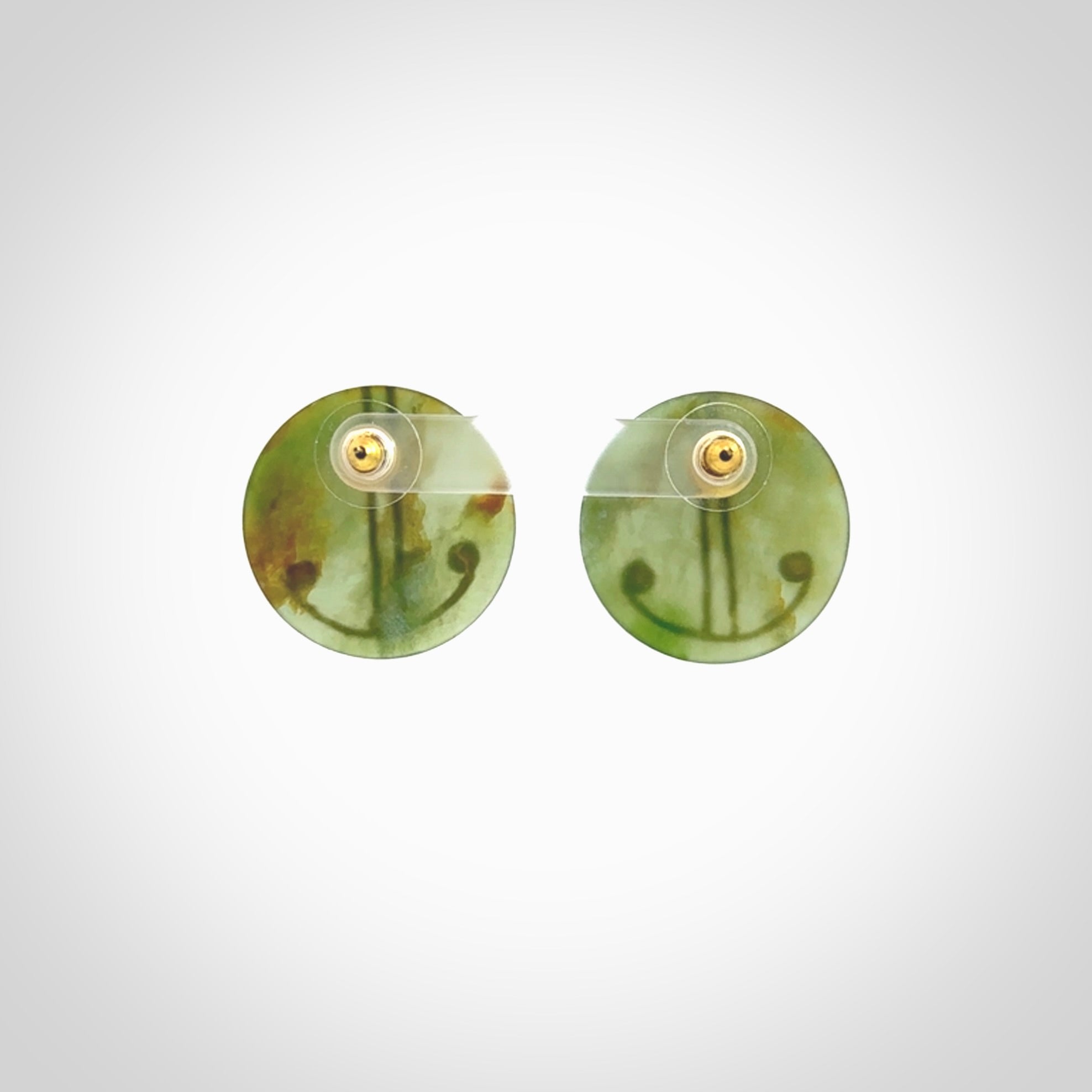 These large round stud earrings are beautifully hand made in New Zealand Jade with Gold Enamel. They have koru designs are are gorgeous. They are fashionable and perfect for a women with style. Hand carved from a gorgeous piece of New Zealand Marsden jade with Gold leaf and gold plated studs - they are elegant and beautiful.