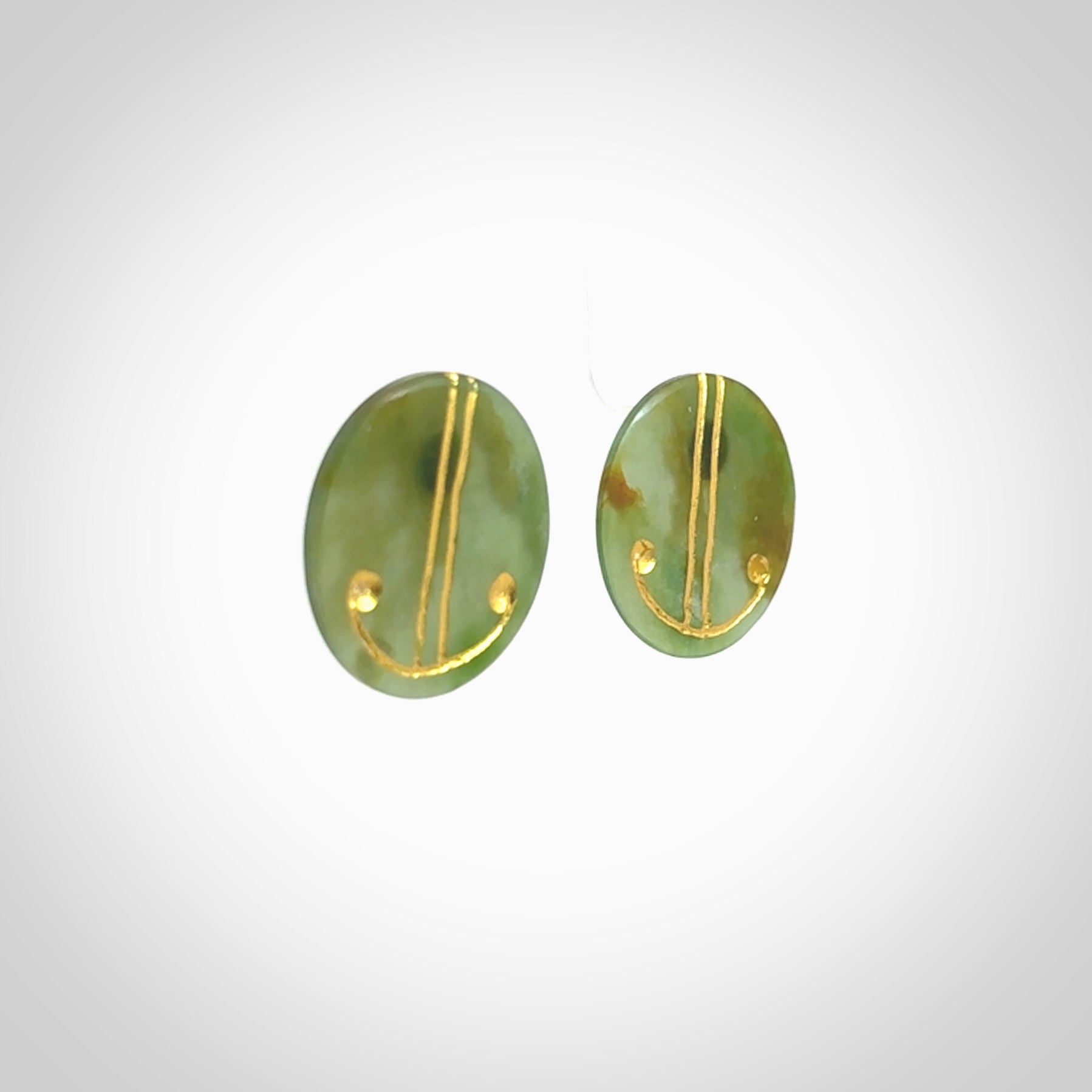 These large round stud earrings are beautifully hand made in New Zealand Jade with Gold Enamel. They have koru designs are are gorgeous. They are fashionable and perfect for a women with style. Hand carved from a gorgeous piece of New Zealand Marsden jade with Gold leaf and gold plated studs - they are elegant and beautiful.