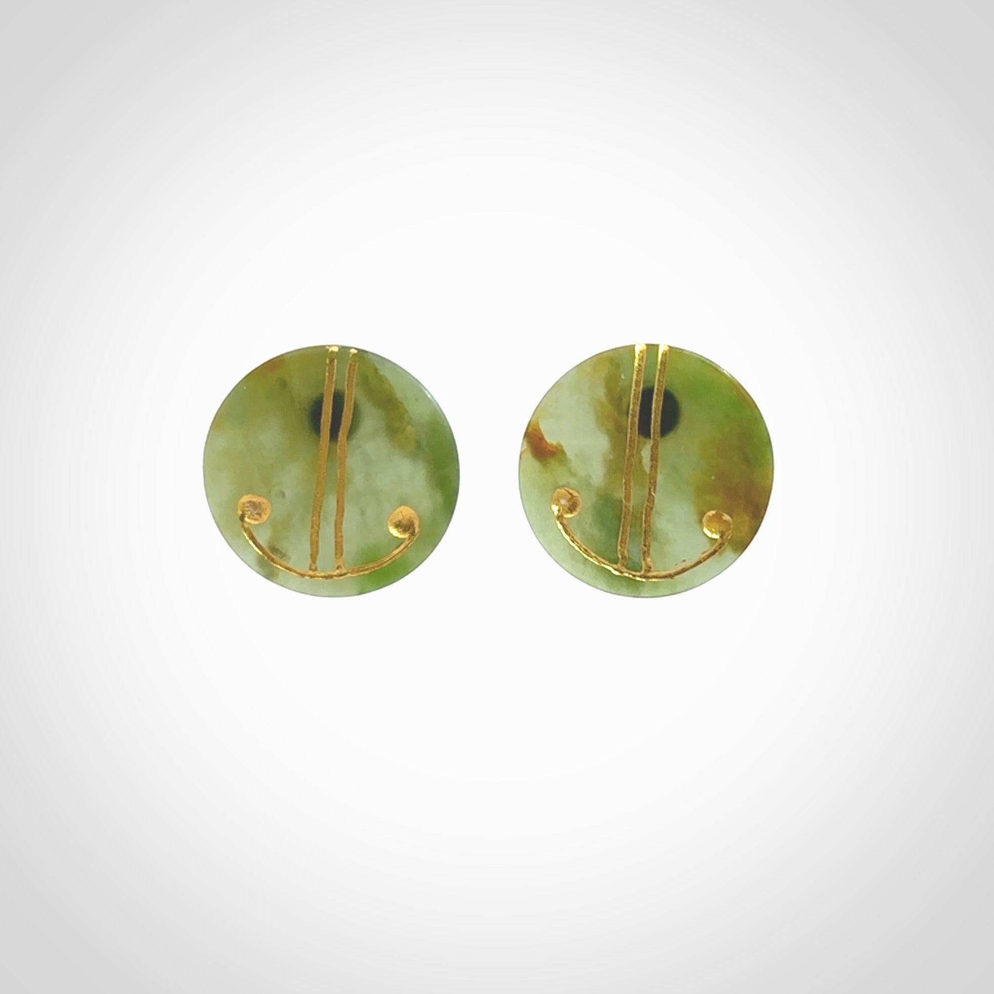 These large round stud earrings are beautifully hand made in New Zealand Jade with Gold Enamel. They have koru designs are are gorgeous. They are fashionable and perfect for a women with style. Hand carved from a gorgeous piece of New Zealand Marsden jade with Gold leaf and gold plated studs - they are elegant and beautiful.