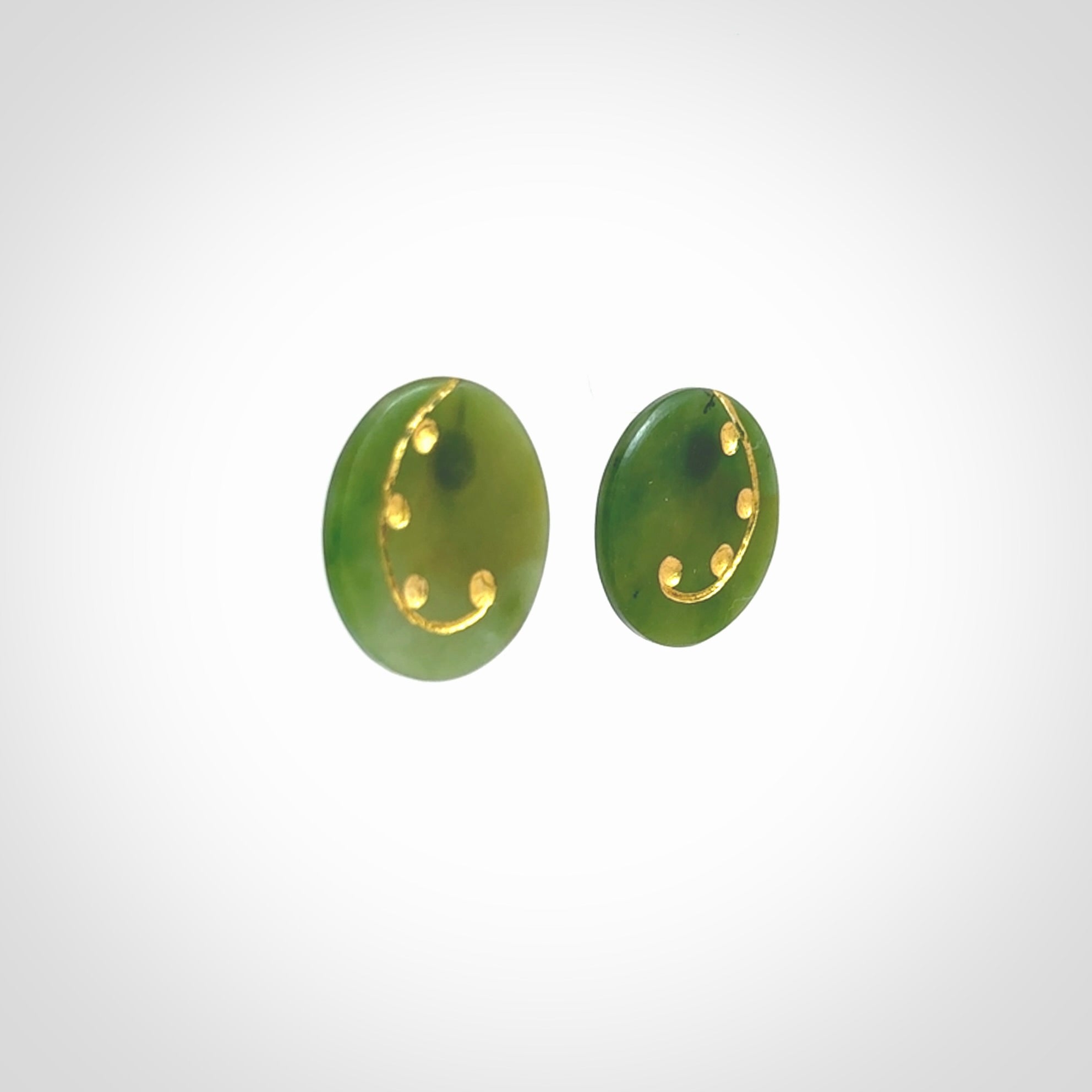 These large round stud earrings are beautifully hand made in New Zealand Jade with Gold Leaf Enamel. They have koru designs are are gorgeous. They are fashionable and perfect for a women with style. Hand carved from a gorgeous piece of New Zealand Marsden jade with Gold leaf and gold plated studs - they are elegant and beautiful.