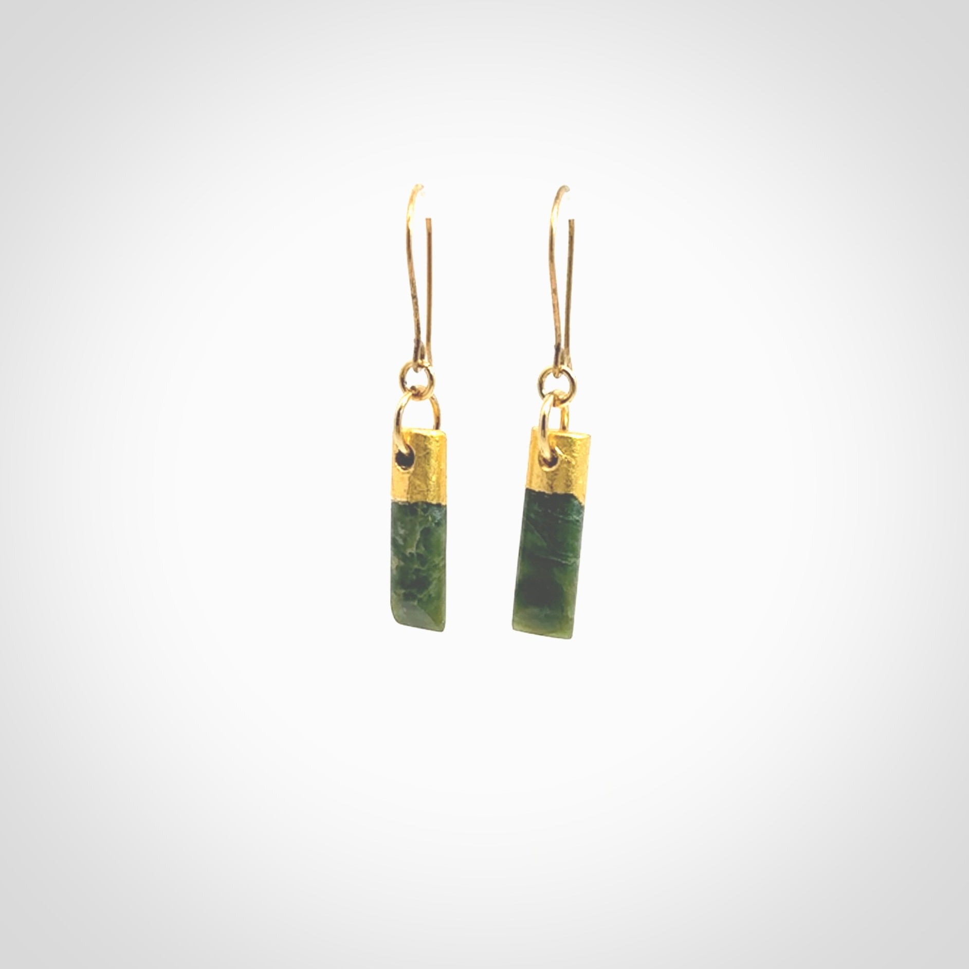 These small drop earrings are beautifully hand made with gorgeous flair. They are fashionable and perfect for a women with style. Hand carved from a gorgeous piece of New Zealand Marsden jade with Gold leaf and gold plated hooks - they are elegant and beautiful.