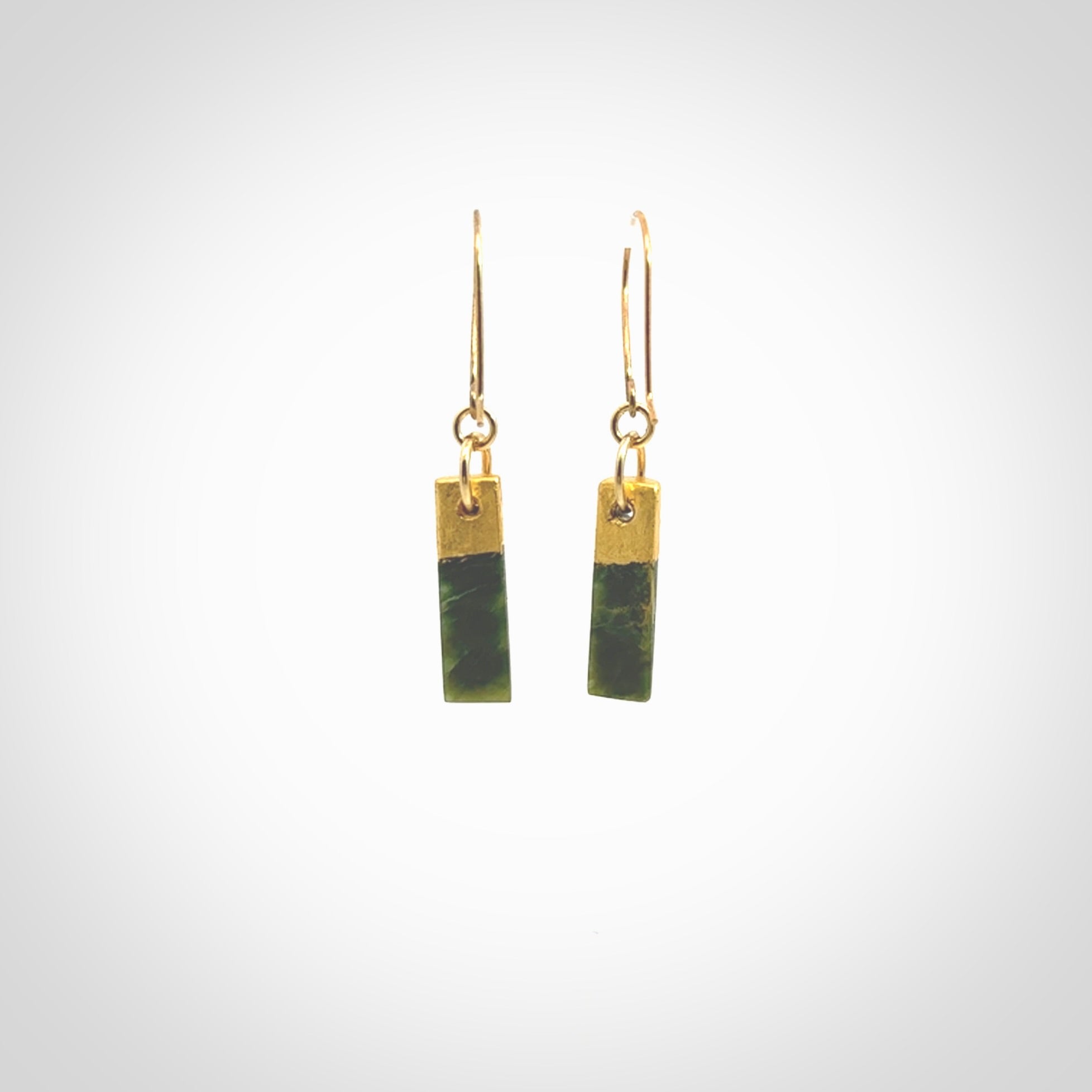 These small drop earrings are beautifully hand made with gorgeous flair. They are fashionable and perfect for a women with style. Hand carved from a gorgeous piece of New Zealand Marsden jade with Gold leaf and gold plated hooks - they are elegant and beautiful.