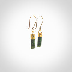 These small drop earrings are beautifully hand made with gorgeous flair. They are fashionable and perfect for a women with style. Hand carved from a gorgeous piece of New Zealand Marsden jade with Gold leaf and gold plated hooks - they are elegant and beautiful.