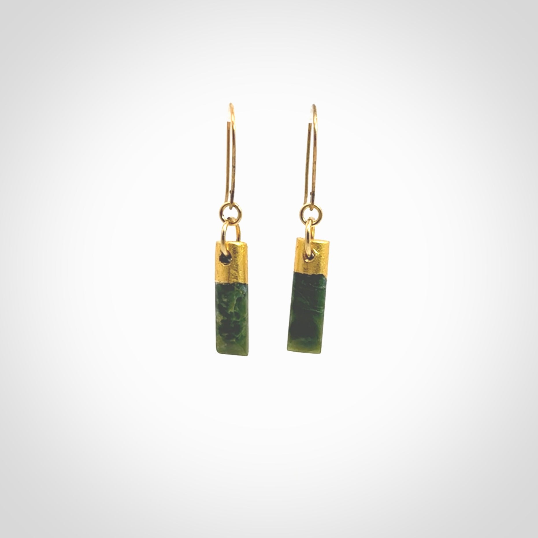 These small drop earrings are beautifully hand made with gorgeous flair. They are fashionable and perfect for a women with style. Hand carved from a gorgeous piece of New Zealand Marsden jade with Gold leaf and gold plated hooks - they are elegant and beautiful.