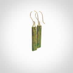 These large drop earrings are beautifully hand made with gorgeous flair. They are fashionable and perfect for a women with style. Hand carved from a gorgeous piece of New Zealand Marsden jade with Gold leaf and gold plated hooks - they are elegant and beautiful.