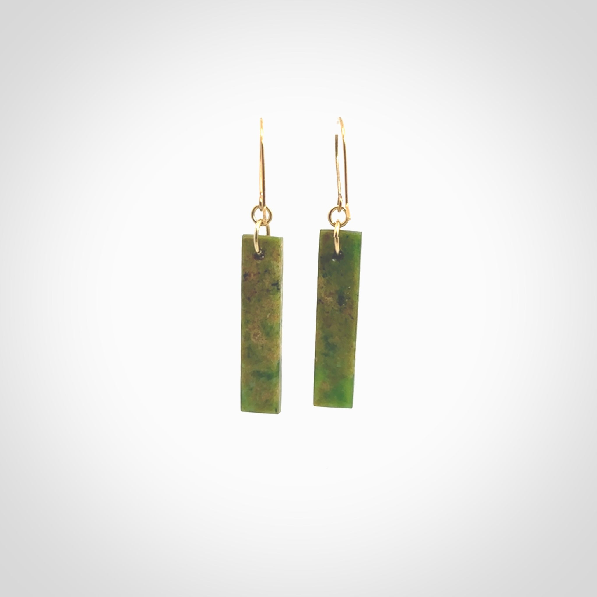 These large drop earrings are beautifully hand made with gorgeous flair. They are fashionable and perfect for a women with style. Hand carved from a gorgeous piece of New Zealand Marsden jade with Gold leaf and gold plated hooks - they are elegant and beautiful.