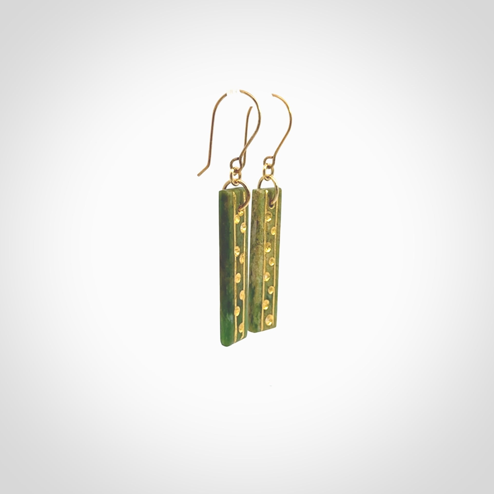 These large drop earrings are beautifully hand made with gorgeous flair. They are fashionable and perfect for a women with style. Hand carved from a gorgeous piece of New Zealand Marsden jade with Gold leaf and gold plated hooks - they are elegant and beautiful.