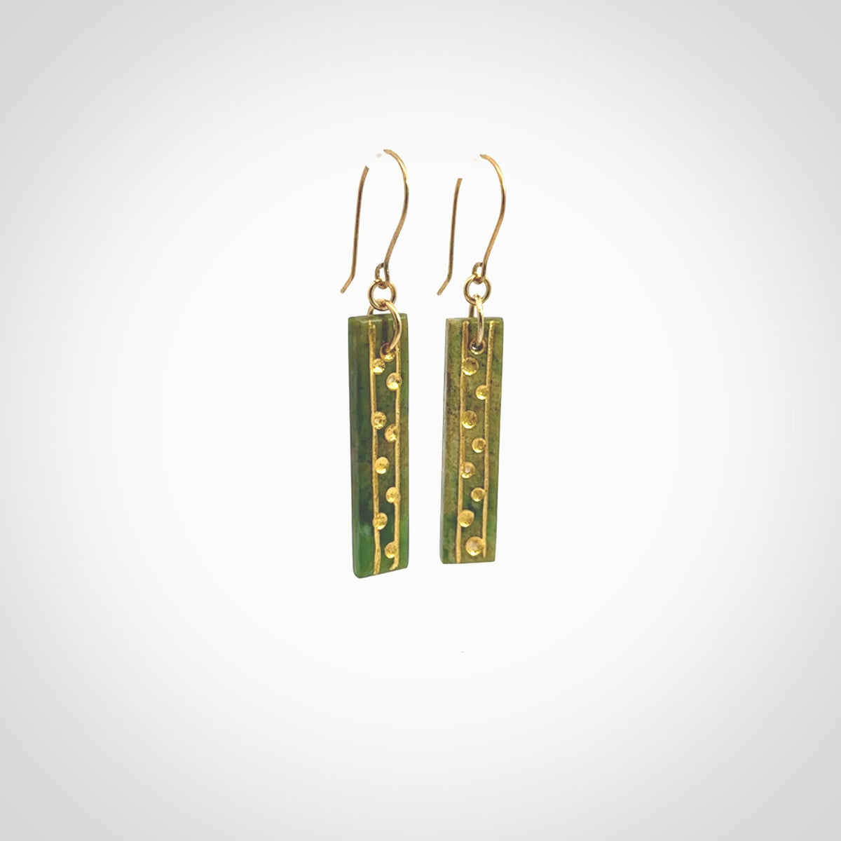 These large drop earrings are beautifully hand made with gorgeous flair. They are fashionable and perfect for a women with style. Hand carved from a gorgeous piece of New Zealand Marsden jade with Gold leaf and gold plated hooks - they are elegant and beautiful.