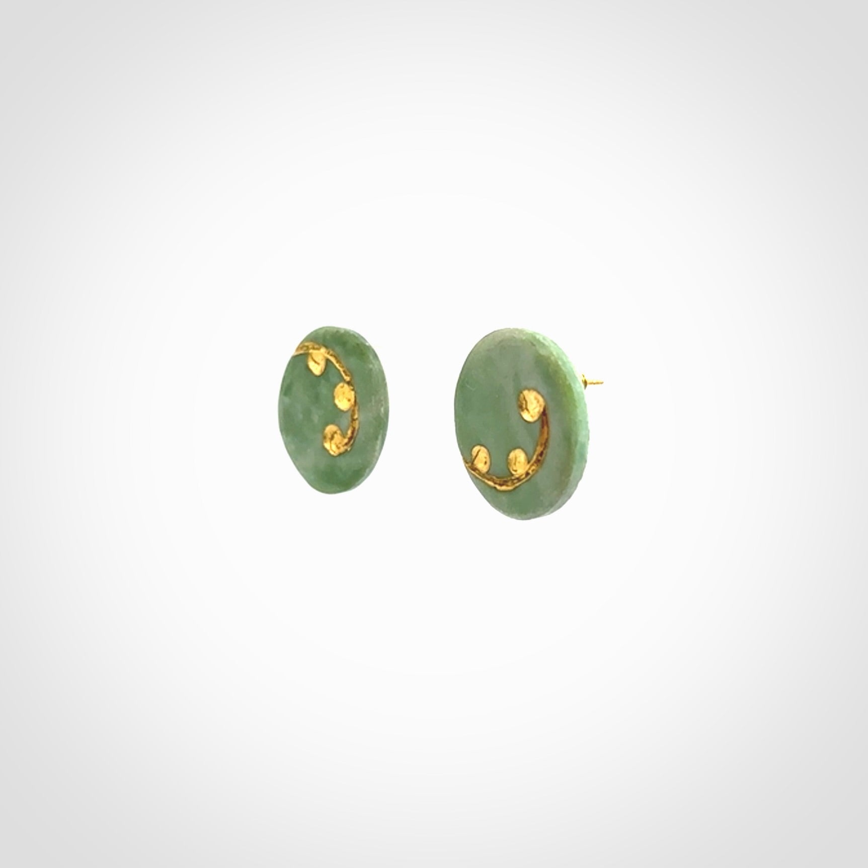 These round stud earrings are beautifully hand made in New Zealand Jade with Gold Leaf Enamel. They have fern leaf designs are are gorgeous. They are fashionable and perfect for a women with style. Hand carved from a gorgeous piece of New Zealand jade with Gold leaf and gold plated studs - they are elegant and beautiful.