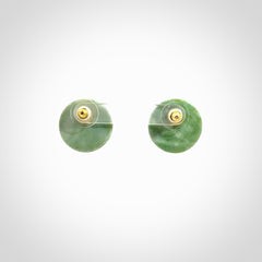 These round stud earrings are beautifully hand made in New Zealand Jade with Gold Leaf Enamel. They have fern leaf designs are are gorgeous. They are fashionable and perfect for a women with style. Hand carved from a gorgeous piece of New Zealand jade with Gold leaf and gold plated studs - they are elegant and beautiful.