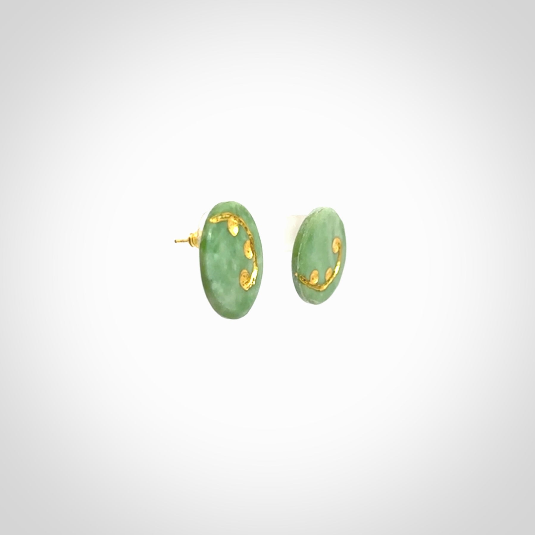 These round stud earrings are beautifully hand made in New Zealand Jade with Gold Leaf Enamel. They have fern leaf designs are are gorgeous. They are fashionable and perfect for a women with style. Hand carved from a gorgeous piece of New Zealand jade with Gold leaf and gold plated studs - they are elegant and beautiful.