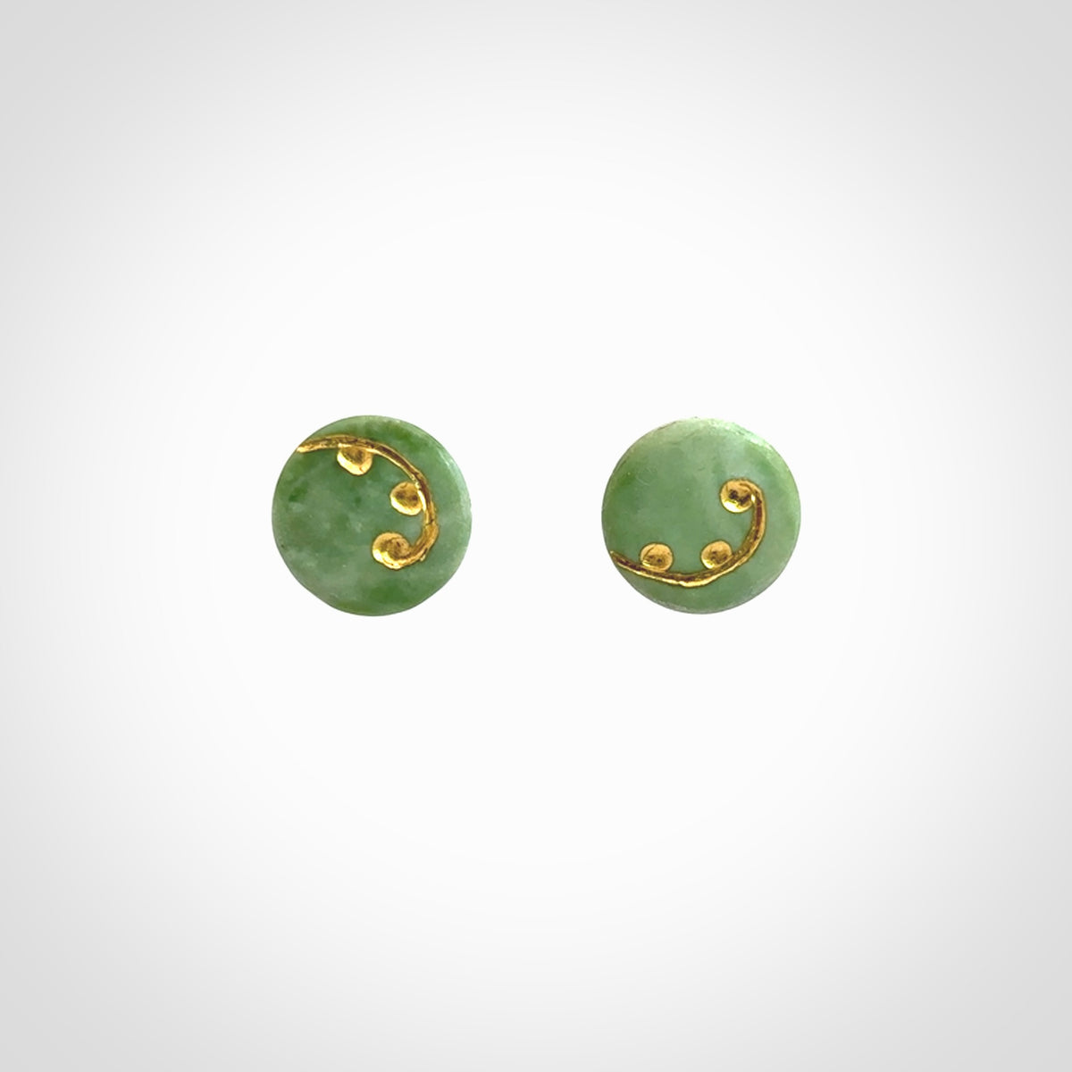 These round stud earrings are beautifully hand made in New Zealand Jade with Gold Leaf Enamel. They have fern leaf designs are are gorgeous. They are fashionable and perfect for a women with style. Hand carved from a gorgeous piece of New Zealand jade with Gold leaf and gold plated studs - they are elegant and beautiful.