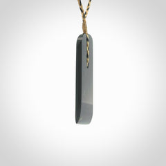 Large New Zealand Tangiwai Pounamu Toki pendant. Hand carved from a lovely piece of local New Zealand Tangiwai Stone. The quality of the workmanship and design is outstanding - this is a piece you will want to wear all the time. We have suspended this from an adjustable 3-plait tan/black cord.