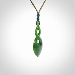 Hand carved New Zealand jade twist pendant. Carved in New Zealand by NZ Pacific. Unique double twist jewellery for sale online. Provided with an adjustable cord.