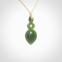 Hand carved New Zealand jade twist pendant. Carved in New Zealand by NZ Pacific. Unique double twist jewellery for sale online. Provided with an adjustable cord.