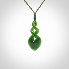 Hand carved New Zealand jade twist pendant. Carved in New Zealand by NZ Pacific. Unique double twist jewellery for sale online. Provided with an adjustable cord.