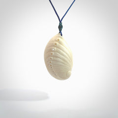 Hand carved bone paua shell with starfish inside pendant. Made from Bone in New Zealand. Unique Pāua Shell necklace hand made from bone with starfish carving inside the shell. Made by master bone carver Fumio Noguchi. Spectacular collectable work of art, made to wear. One only pendant, delivered to you with express courier on a blue adjustable cord.