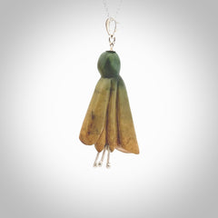 This kowhai flower drop pendant is beautifully hand made with gorgeous flair. It is fashionable and perfect for a women with style. Hand carved from a gorgeous piece of New Zealand Flower jade and sterling silver - this is an elegant and beautiful piece of art to wear.