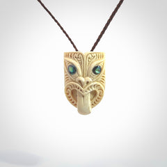 Hand carved Wheku pendant. Carved from woolly mammoth Tusk by NZ Pacific. Hand crafted Mammoth tusk jewellery for sale online. Provided with an adjustable cord and packaged in woven kete pouch.