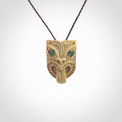 Hand carved Wheku pendant. Carved from woolly mammoth Tusk by NZ Pacific. Hand crafted Mammoth tusk jewellery for sale online. Provided with an adjustable cord and packaged in woven kete pouch.