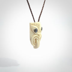 Hand carved Wheku pendant. Carved from woolly mammoth Tusk by NZ Pacific. Hand crafted Mammoth tusk jewellery for sale online. Provided with an adjustable cord and packaged in woven kete pouch