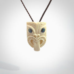 Hand carved Wheku pendant. Carved from woolly mammoth Tusk by NZ Pacific. Hand crafted Mammoth tusk jewellery for sale online. Provided with an adjustable cord and packaged in woven kete pouch