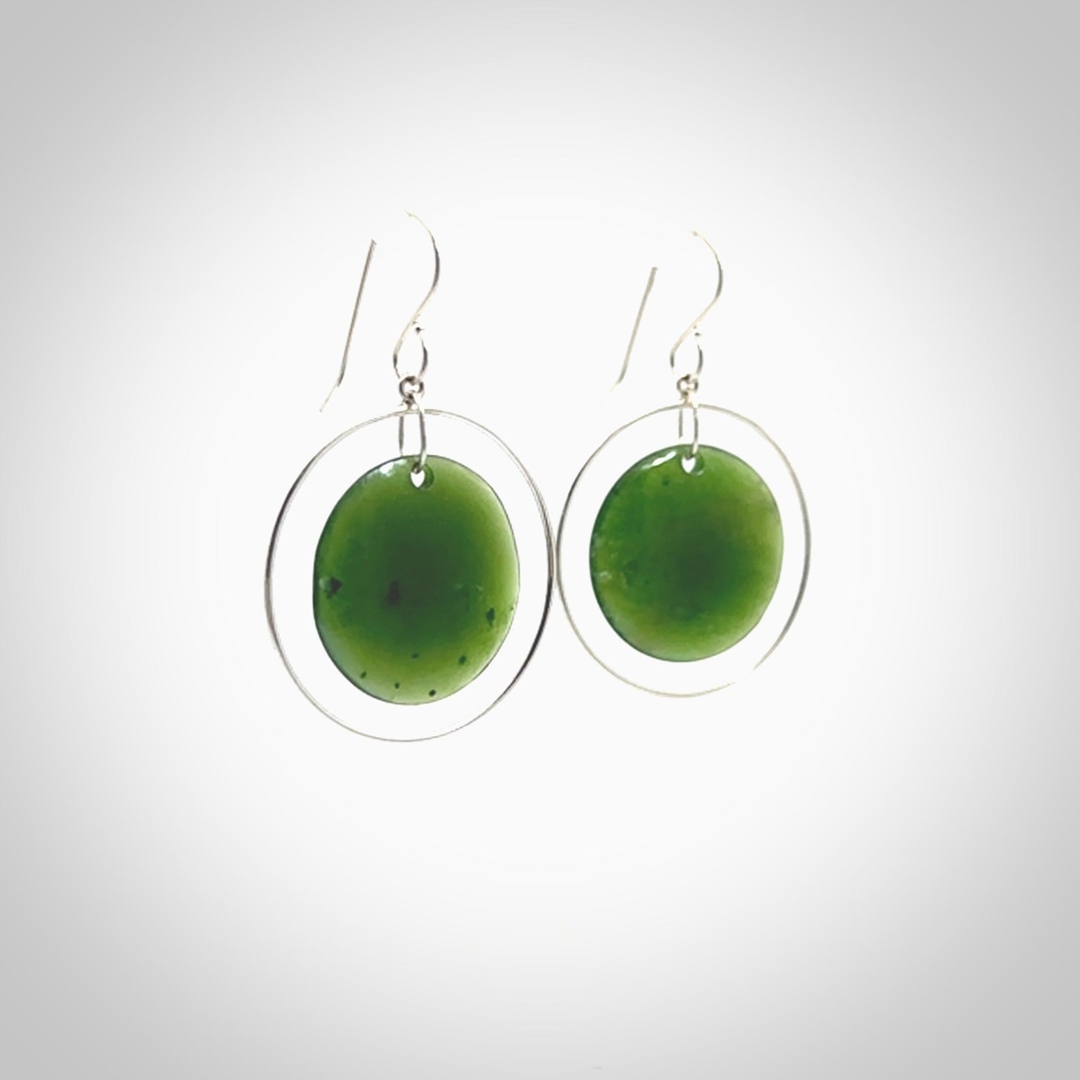 Hand carved medium New Zealand jade circle earrings. Made by NZ Pacific from real jade. Online jewellery for sale online by NZ Pacific.