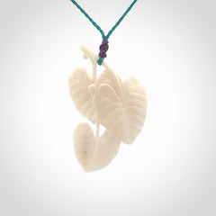 A hand carved large bone water-lily necklace. A beautiful large Nuphar, water-lily pendant carved from bone for NZ Pacific. This is a true piece of wearable art and is provided with an adjustable cord.