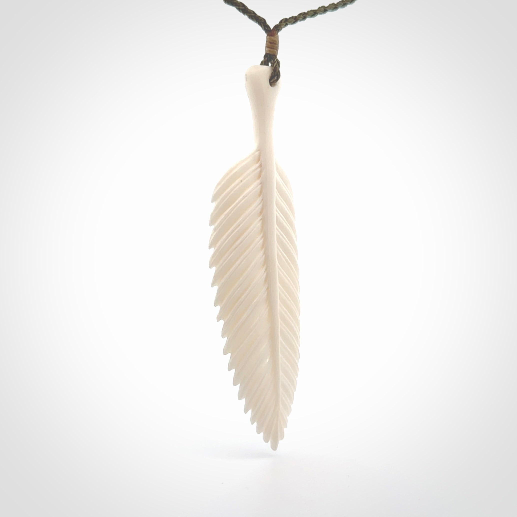 A hand carved large bone fern leaf necklace. A beautiful large fern leaf pendant carved from bone for NZ Pacific. This is a true piece of wearable art and is provided with an adjustable cord.