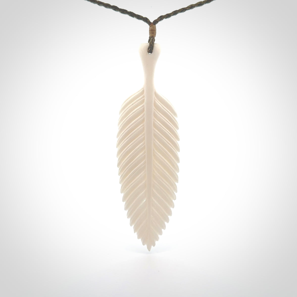 A hand carved large bone fern leaf necklace. A beautiful large fern leaf pendant carved from bone for NZ Pacific. This is a true piece of wearable art and is provided with an adjustable cord.