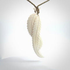 A hand carved large bone double fern leaf necklace. A beautiful large double fern leaf pendant carved from bone for NZ Pacific. This is a true piece of wearable art and is provided with an adjustable cord.