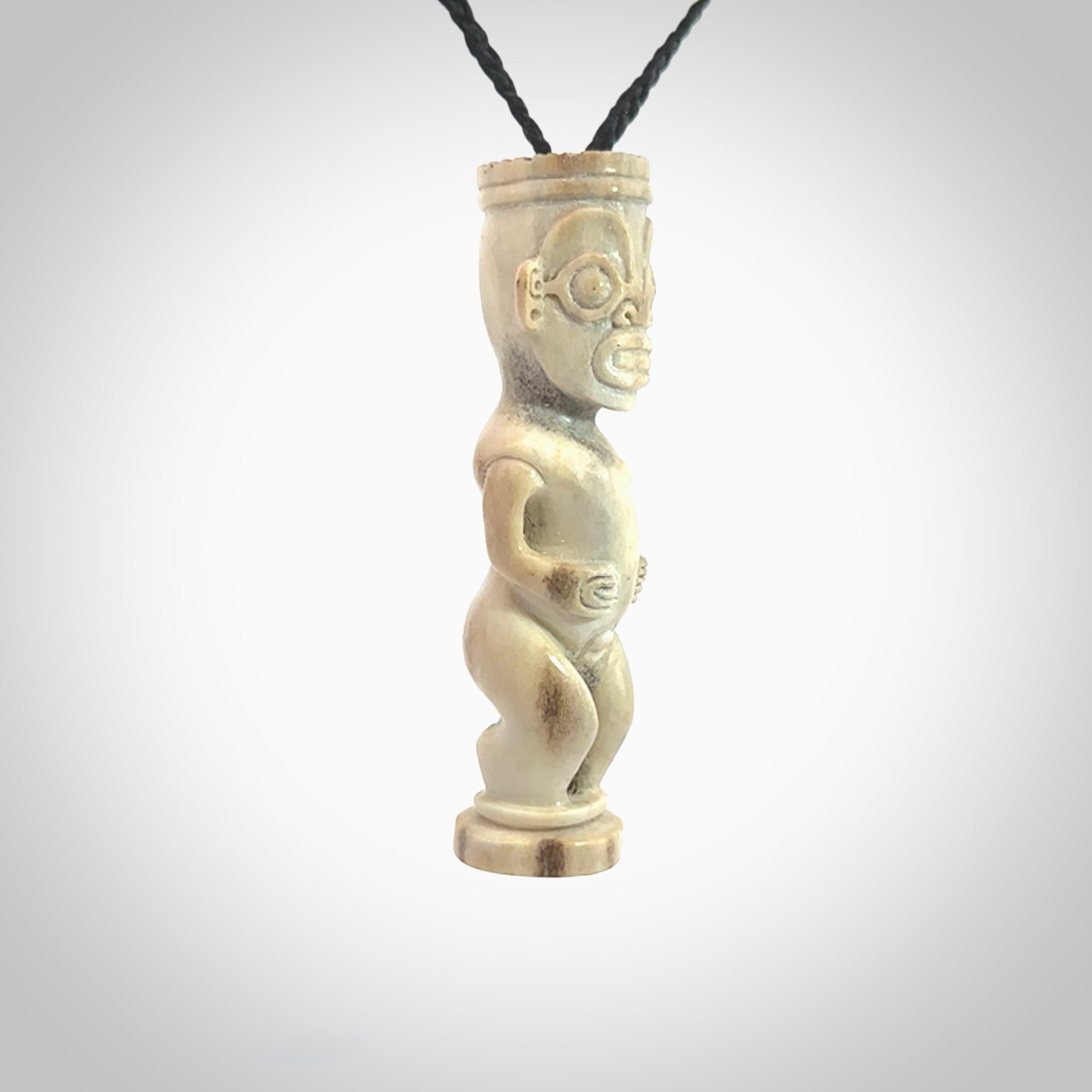 A traditional Papua New Guinea design carving , hand made for us from bone. This is a work of art and is a collectable piece of traditional bone carving. It can be worn as a special piece of jewellery or displayed. This is art made to wear at its finest.