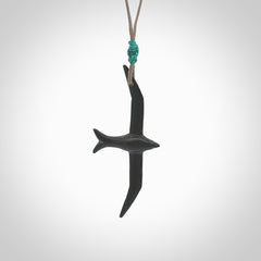 Hand carved black jade petrel bird pendant. Made by NZ Pacific, unique jewellery for sale online. Black Jade petrel bird necklaces with adjustable cords. Delivered with express courier and packaged in a woven kete pouch.