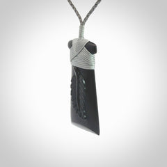 A gorgeous black jade toki pendant, carved with New Zealand's silver fern in relief. This is a pendant we designed for the Rugby World Cup. It is the fern that our national team the All Blacks wear on their jerseys, and the black is the colour of their team uniform. A fantastic and visually striking pendant, designed and carved by NZ Pacific.