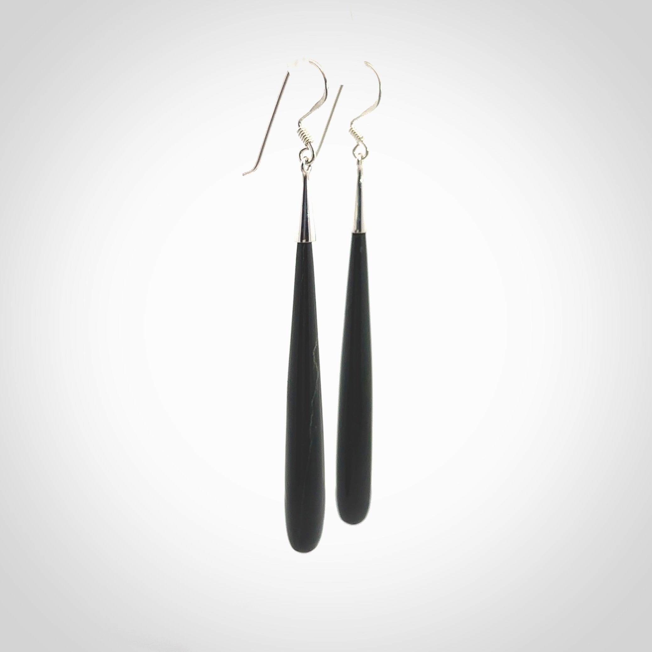 Hand carved Australian Black Jade Earrings. Made by NZ Pacific and for sale online. Hand made Black Jade with Sterling Silver Jewellery. Large Black Jade earrings. Delivered in a woven kete pouch.