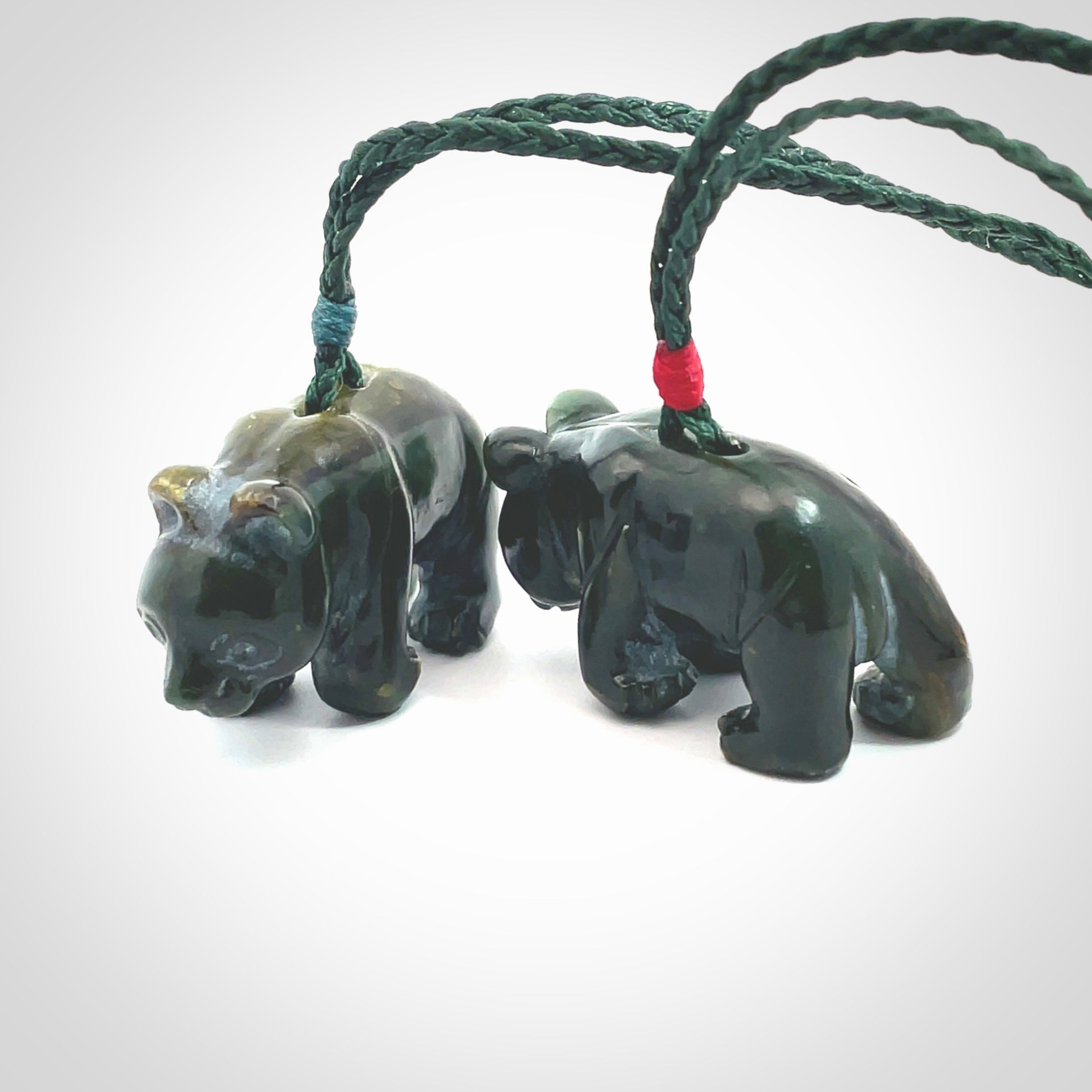 This picture shows a pendant that we designed in New Zealand jade. It is a little green bear that has a walking stance and is carved in detail. A really attractive and eye-catching piece of handmade jewellery. The cord is hand plaited braid in manuka green and the length can be adjusted.