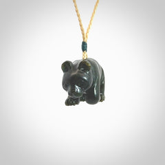 This picture shows a pendant that we designed in New Zealand jade. It is a little green bear that has a walking stance and is carved in detail. A really attractive and eye-catching piece of handmade jewellery. The cord is hand plaited braid and the length can be adjusted.