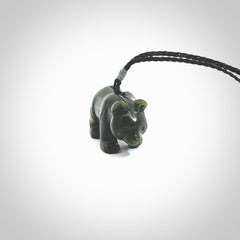 This picture shows a pendant that we designed in New Zealand jade. It is a little green bear that has a walking stance and is carved in detail. A really attractive and eye-catching piece of handmade jewellery. The cord is hand plaited braid and the length can be adjusted.